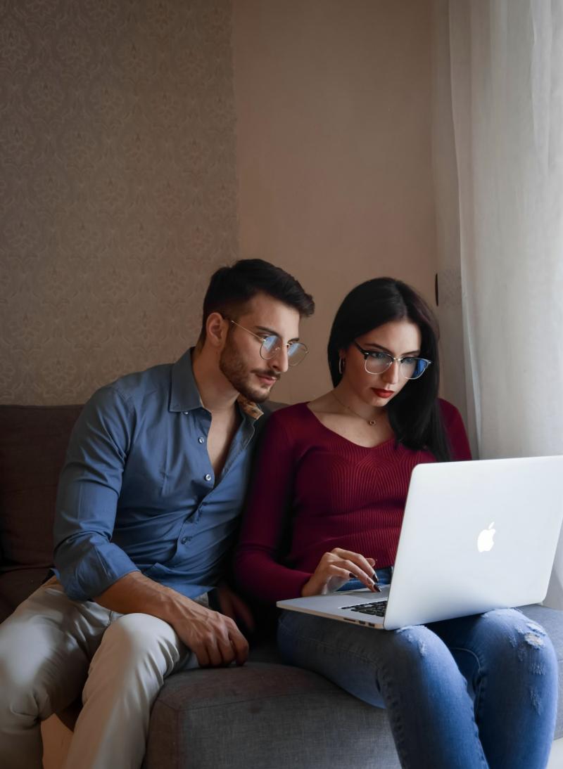 A couple reviewing their insurance together on a laptop at home